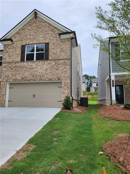 Front exterior of a new home in , Loganville, GA, highlighting curb appeal (Image 21). Front exterior of a new home in , Loganville, GA, highlighting curb appeal (Image 21).