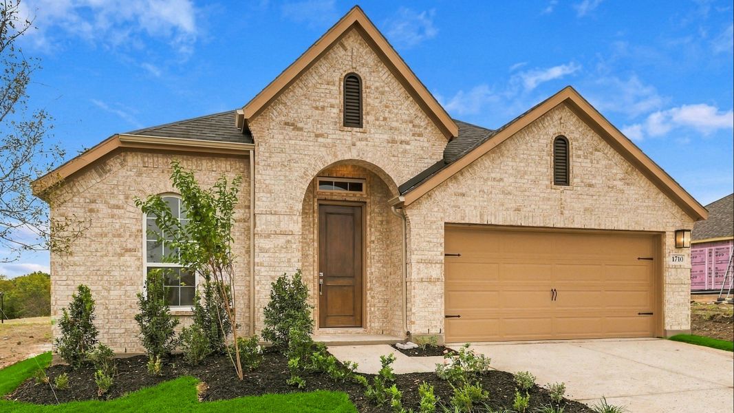 Front exterior of a new home in Thompson Farms, Van Alstyne, TX, highlighting curb appeal (Image 24). Front exterior of a new home in Thompson Farms, Van Alstyne, TX, highlighting curb appeal (Image 24).