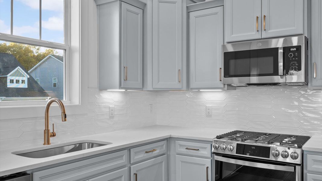 Highly functional kitchen offering a refined look and practical island at the center