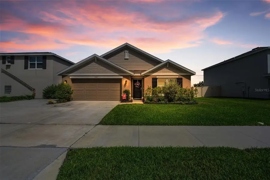 Front exterior of a new home in Pine Creek, Spring Hill, FL, highlighting curb appeal (Image 1). Front exterior of a new home in Pine Creek, Spring Hill, FL, highlighting curb appeal (Image 1).