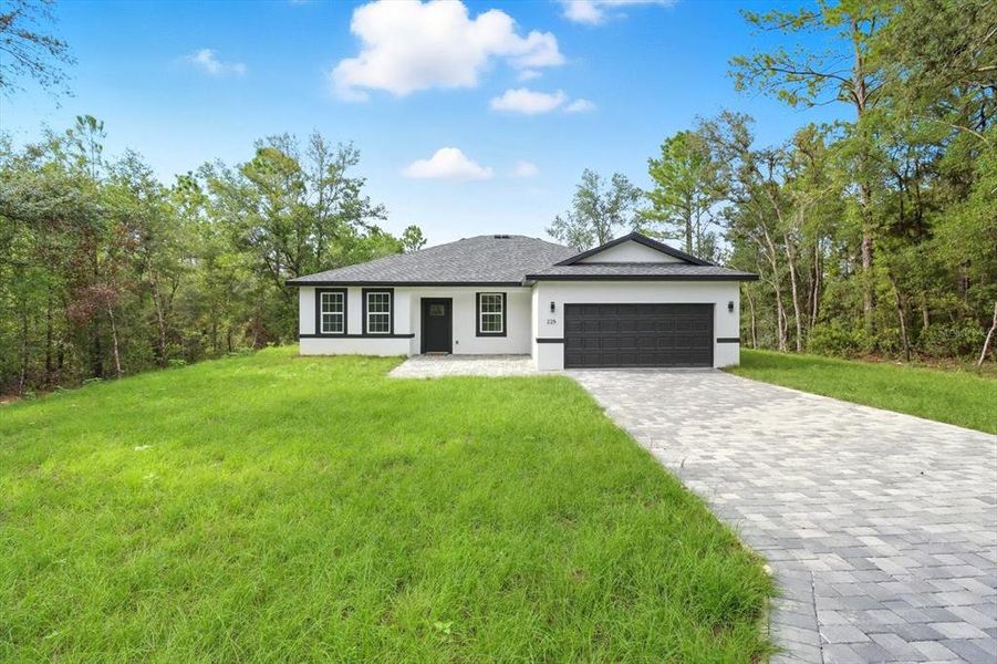 Front exterior of a new home in , Citrus Springs, FL, highlighting curb appeal (Image 19).