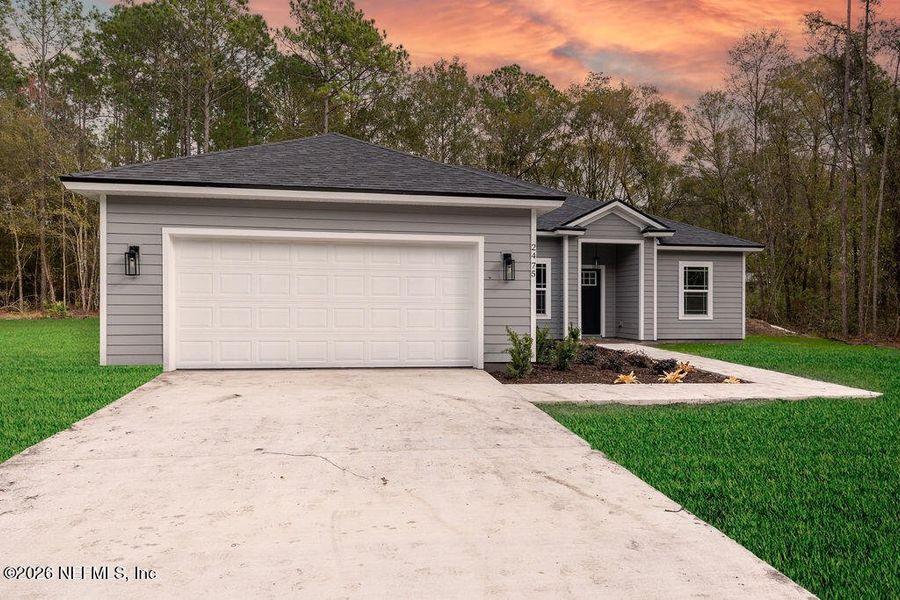 Front exterior of a new home in , Middleburg, FL, highlighting curb appeal (Image 15). Front exterior of a new home in , Middleburg, FL, highlighting curb appeal (Image 15).