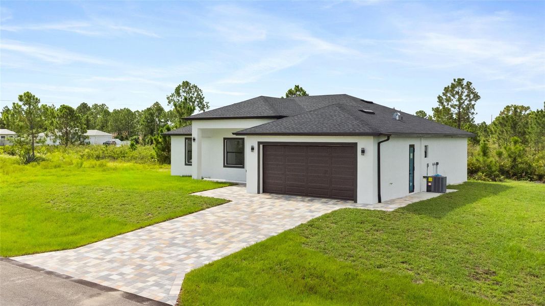 Front exterior of a new home in , Lehigh Acres, FL, highlighting curb appeal (Image 23).