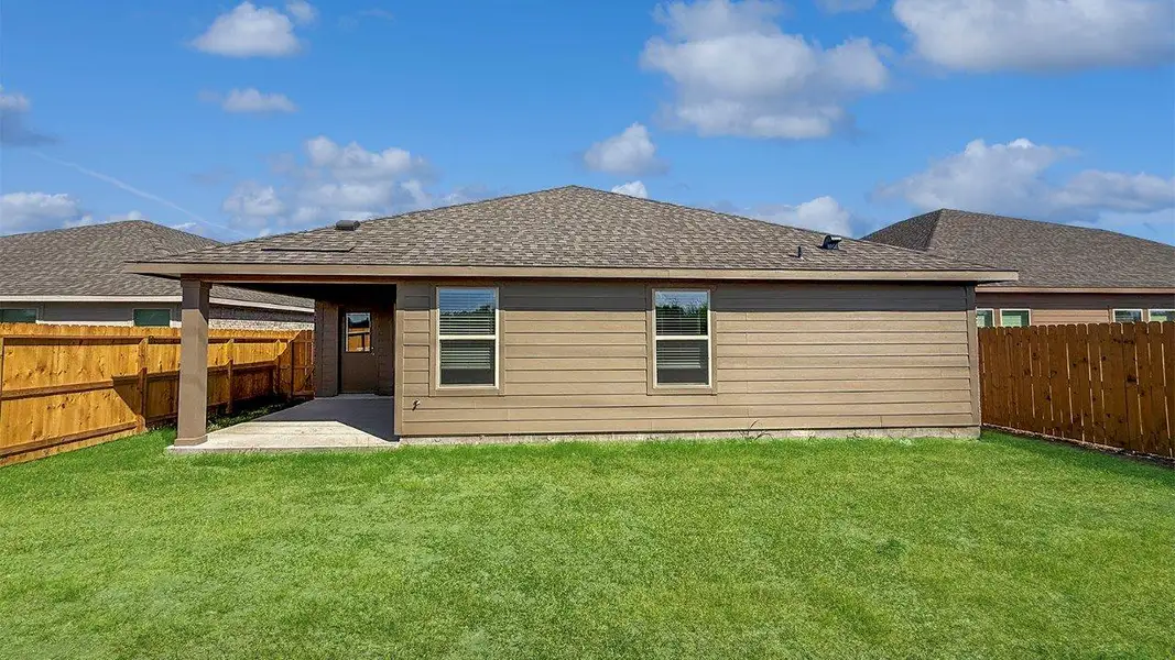 Front exterior of a new home in Rancho Vista, Corpus Christi, TX, highlighting curb appeal (Image 2). Front exterior of a new home in Rancho Vista, Corpus Christi, TX, highlighting curb appeal (Image 2).