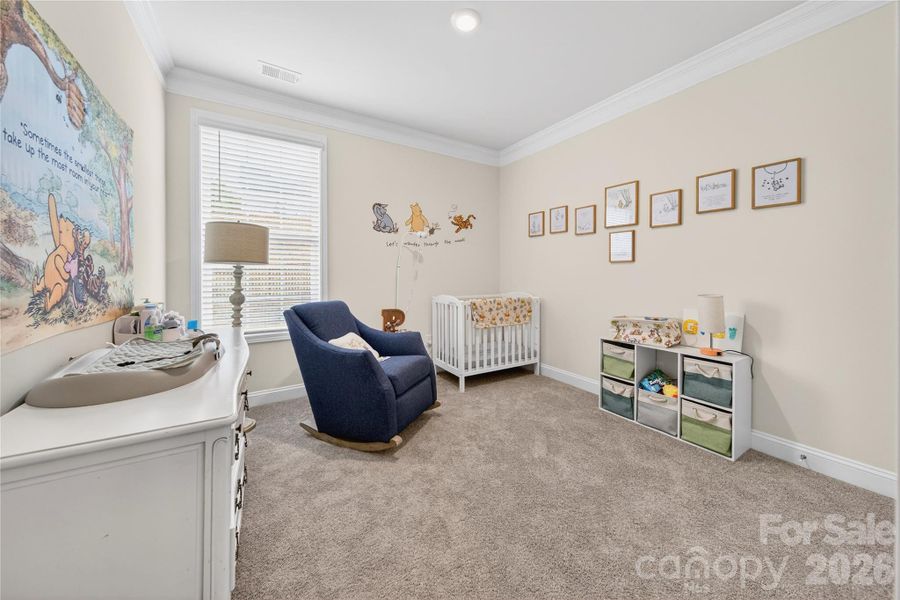 Main level bedroom provides needed space for guests.