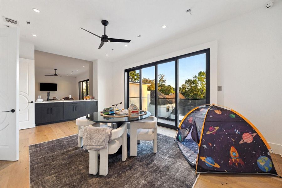 Indulge your guests in a sophisticated setting with a dedicated game room, half guest bathroom and wet bar extending to an outdoor terrace