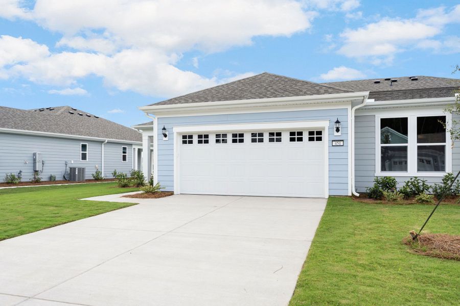 Front exterior of a new home in Sun City Hilton Head, Bluffton, SC, highlighting curb appeal (Image 21).