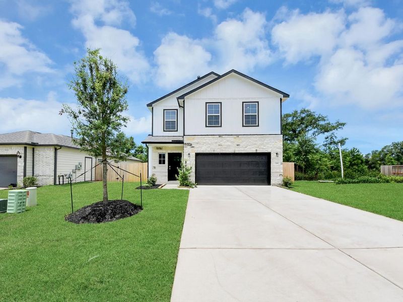 Front exterior of a new home in Caney Creek Place, Conroe, TX, highlighting curb appeal (Image 19).