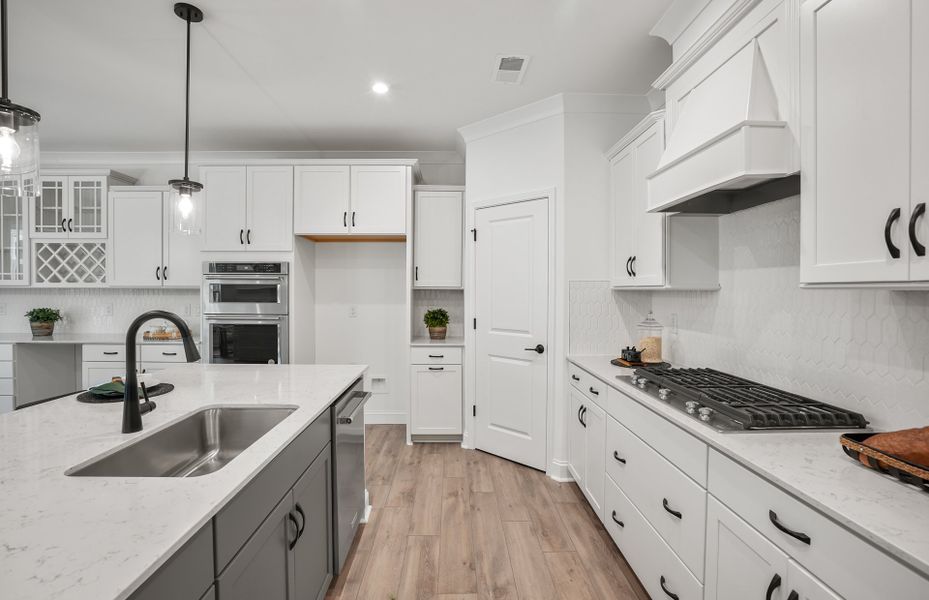 Bright Open Kitchen with Large Island and Café