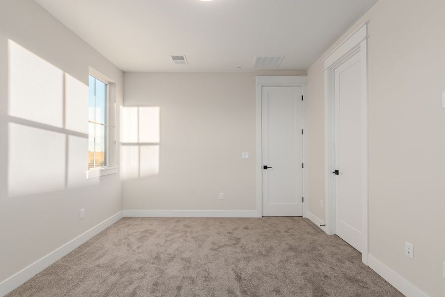 Representative unfurnished interior of a home built from the Luxe by Scott Felder Homes in Westerly, Erie (Image 48).