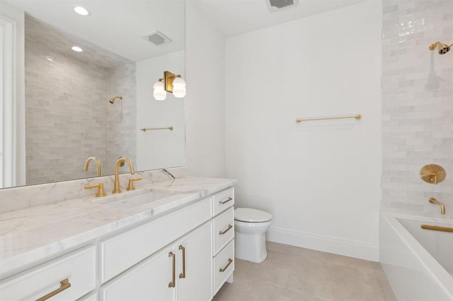 Bathroom with vanity, recessed lighting, and tub / shower combination