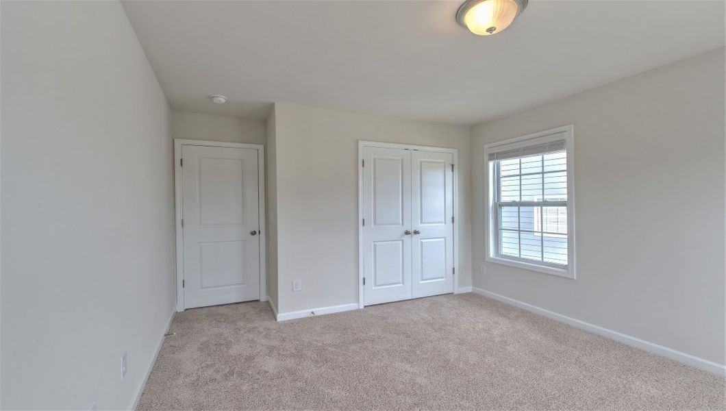 Spacious, unfurnished interior of a new home in Reserve at Tap Root Farms, Fletcher (Image 27). Spacious, unfurnished interior of a new home in Reserve at Tap Root Farms, Fletcher (Image 27).
