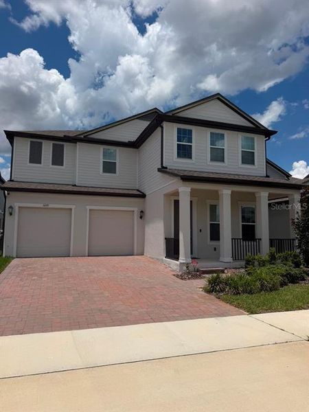Front exterior of a new home in , Winter Garden, FL, highlighting curb appeal (Image 26).