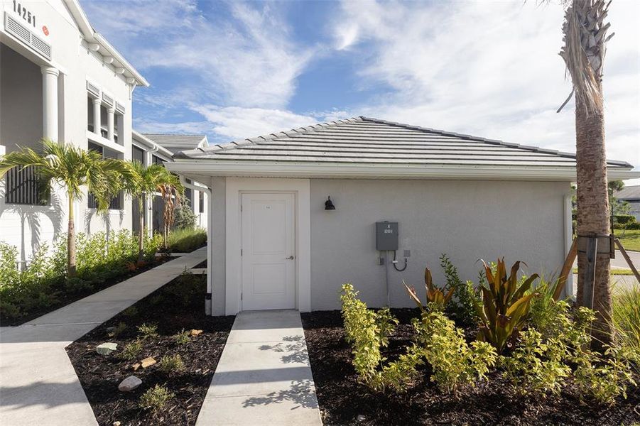 Front exterior of a new home in , Punta Gorda, FL, highlighting curb appeal (Image 1).