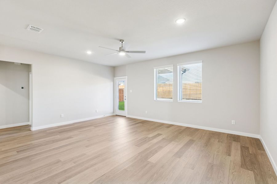 Living Room in the Haylee home plan by Trophy Signature Homes - REPRESENTATIVE PHOTO