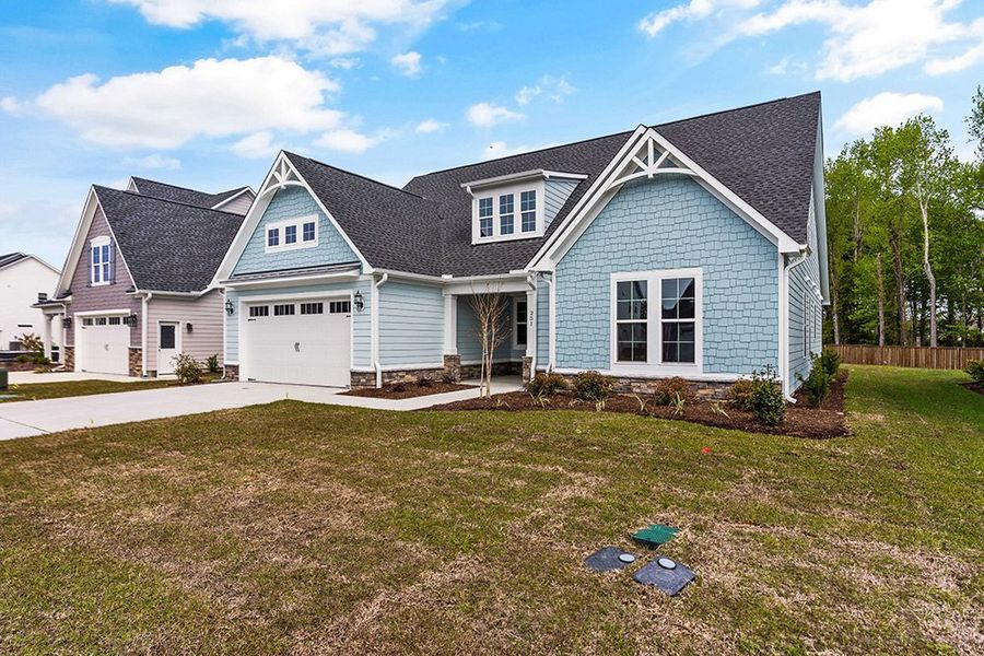 Representative exterior photo of a completed home built from the The Bradley by RobuckHomes in Windwater, Hampstead, NC (Image 2).