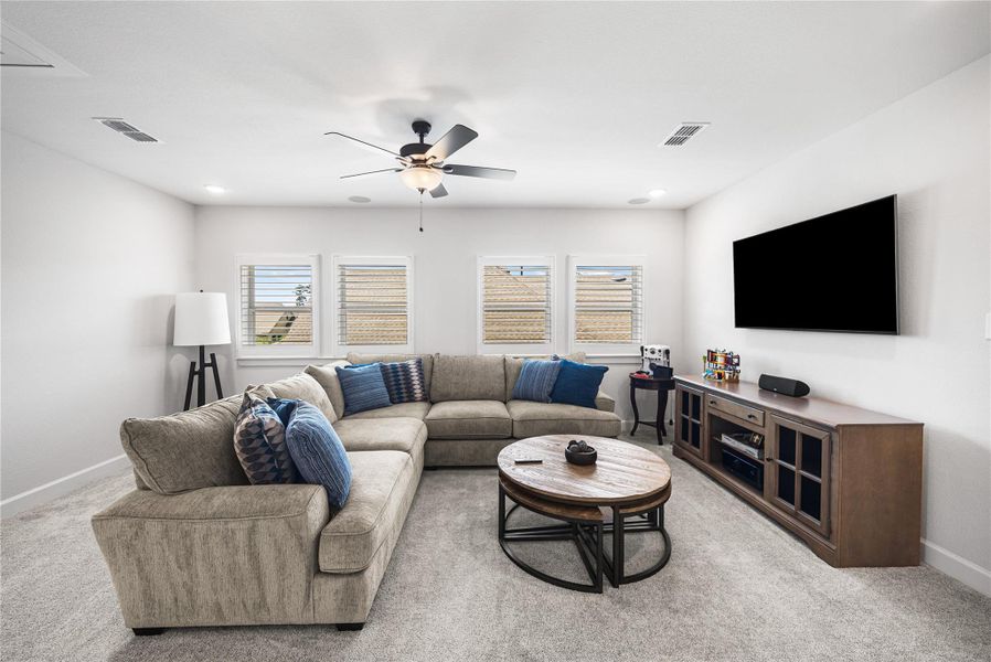 Gameroom with lots of natural light and space.