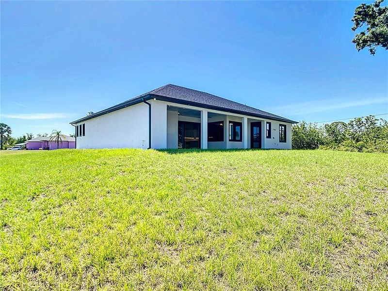 Front exterior of a new home in , Englewood, FL, highlighting curb appeal (Image 12).