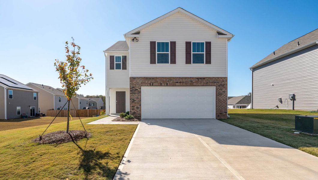 Front exterior of a new home in Durbin Meadows, Fountain Inn, SC, highlighting curb appeal (Image 1).