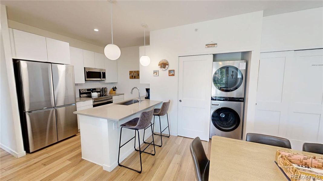 Open Floor Plan: Kitchen - Dining - Laundry
