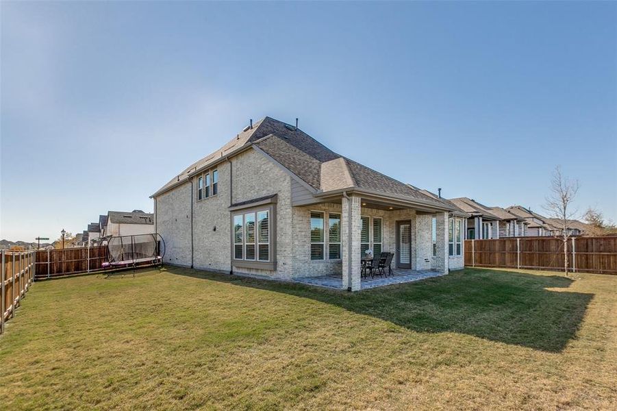 The side yard was extended by moving the fence further towards the front of the house.