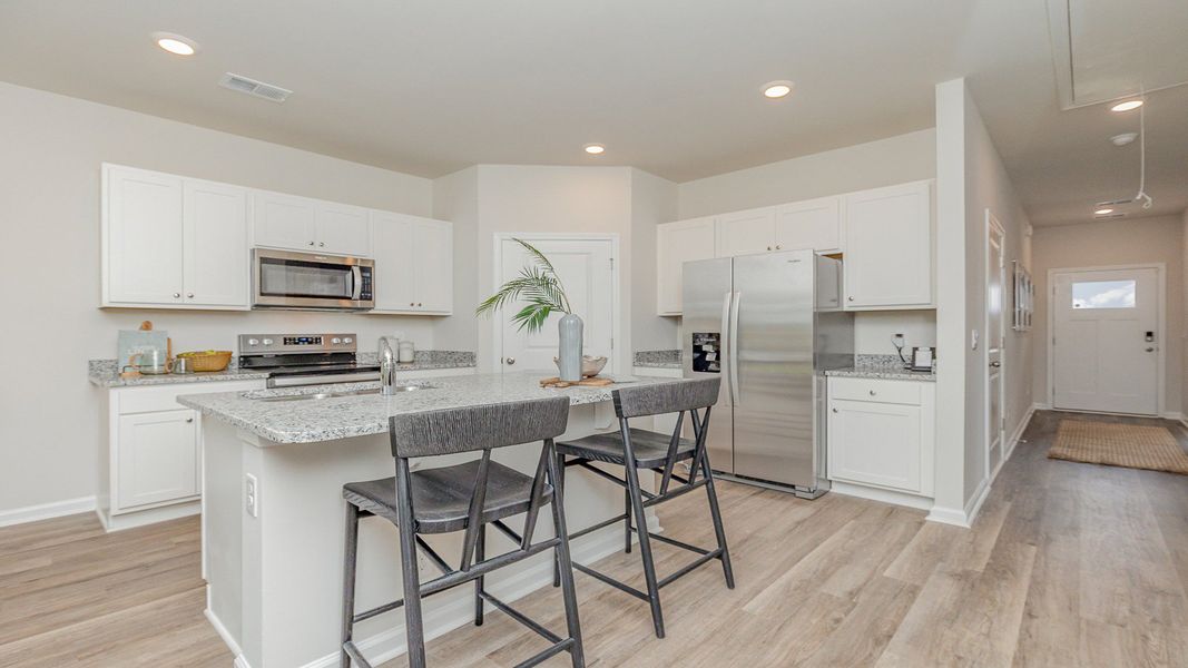 Furnished interior view inside a new home in Rich Square at Brunswick Plantation, Ash (Image 3).