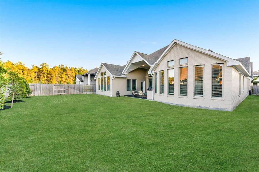 Exterior details and patio area of a home in ARTAVIA 65', Conroe (Image 20).
