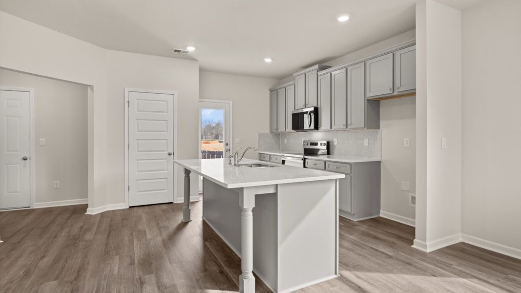 Representative furnished interior of a home built from the Ashmore by D.R. Horton in Brookland Commons, Monroe (Image 7).
