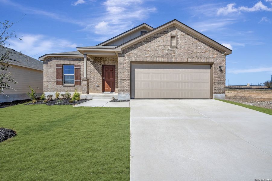 Front exterior of a new home in Paloma Park, Converse, TX, highlighting curb appeal (Image 26).