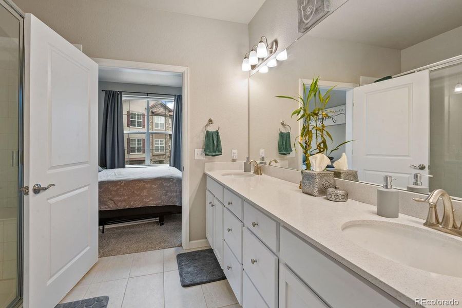 Double Vanity Quartz Countertops In Primary Bathroom