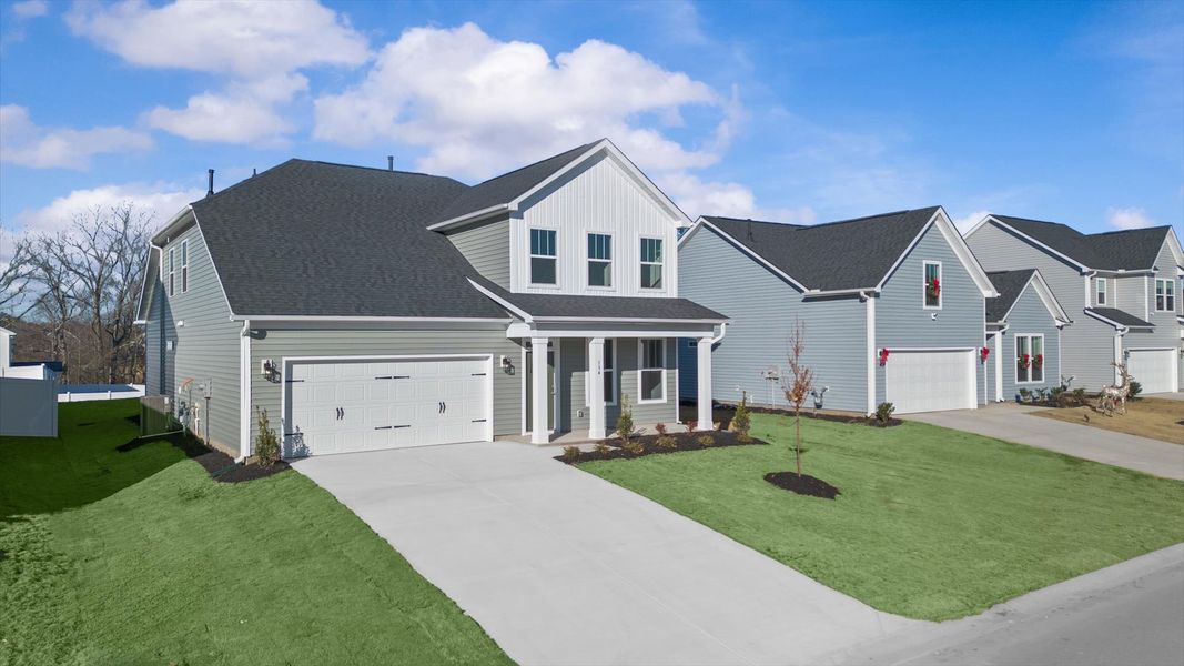 Exclusive DRB Homes exterior with balanced proportions and vibrant curb appeal