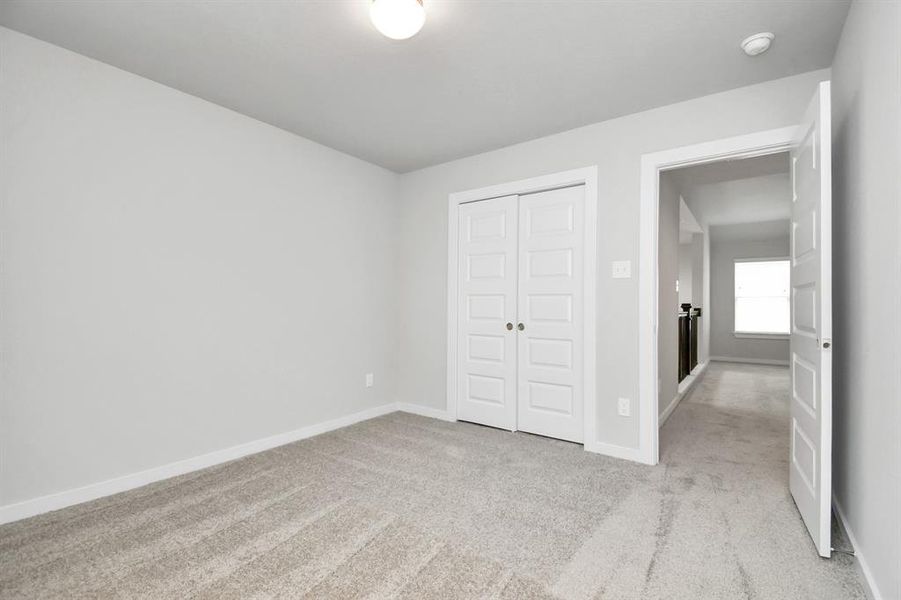 Generously sized secondary bedrooms, complete with spacious closets and soft, inviting carpeting.