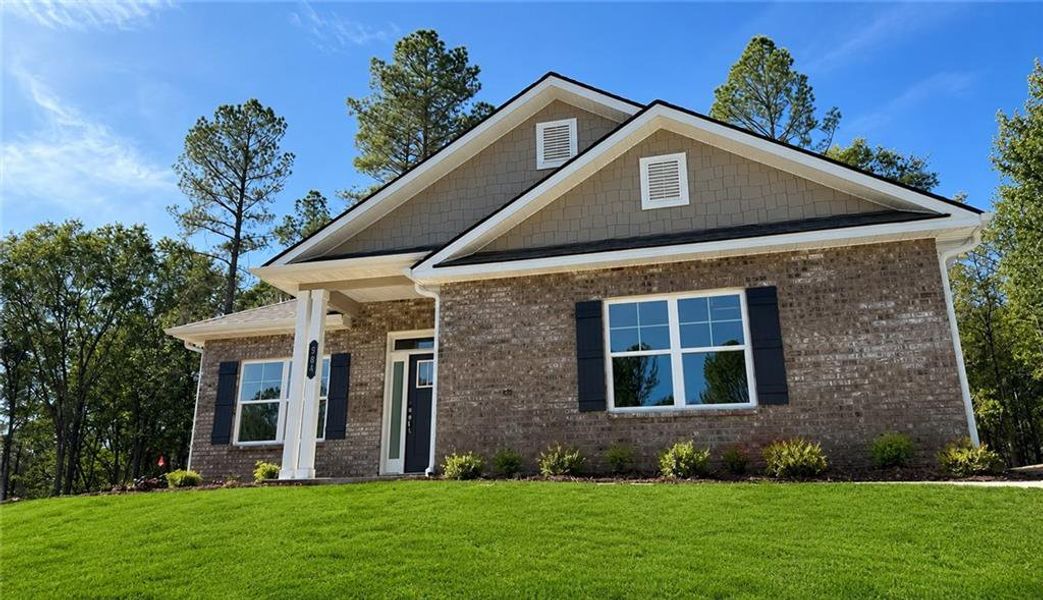 Front exterior of a new home in The Fields of Walnut Creek, Pendergrass, GA, highlighting curb appeal (Image 16).