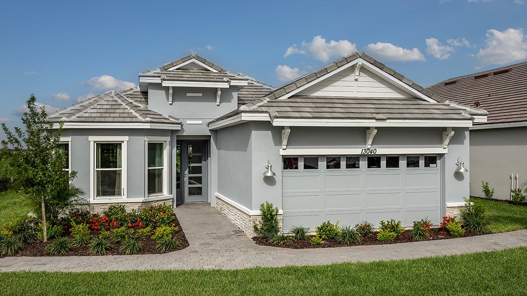 Representative exterior photo of a completed home built from the Farnese by Taylor Morrison in Astor Creek Golf and Country Club, Port St. Lucie, FL (Image 22).