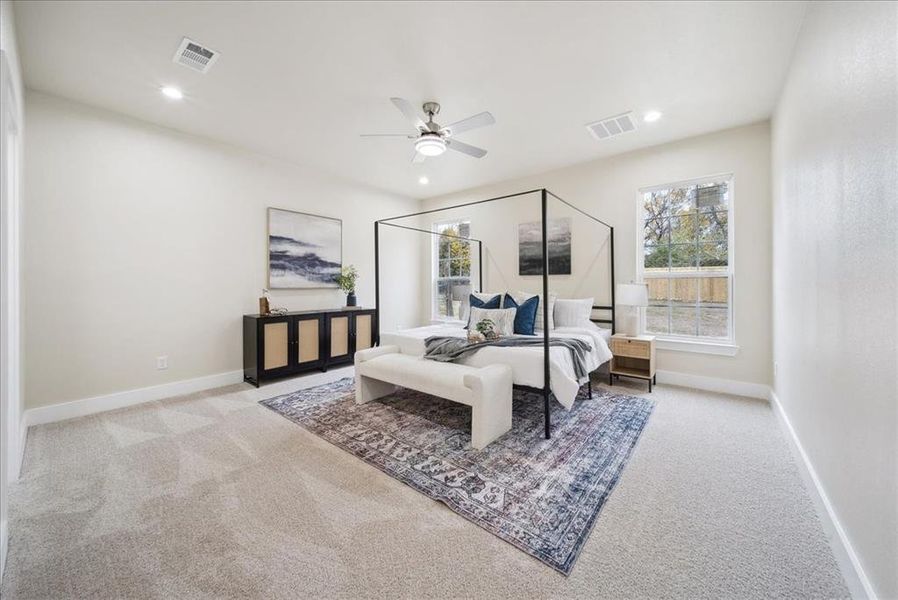 Bedroom featuring ceiling fan and light colored carpet