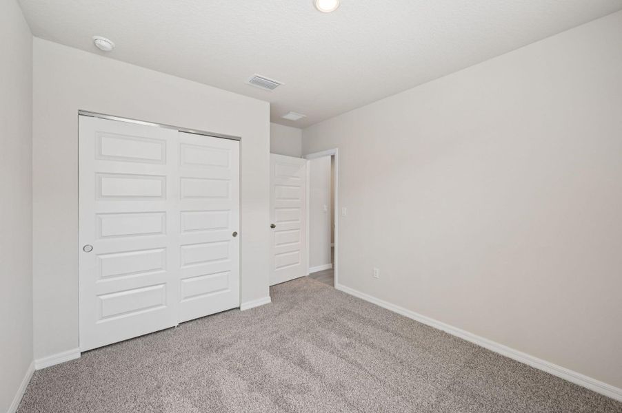 Spacious, unfurnished interior of a new home in Hampton Park - Classic Series, Vero Beach (Image 23).