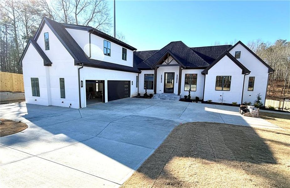 Front exterior of a new home in , Flowery Branch, GA, highlighting curb appeal (Image 7).