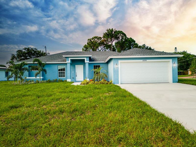 Front exterior of a new home in , Palm Bay, FL, highlighting curb appeal (Image 25).