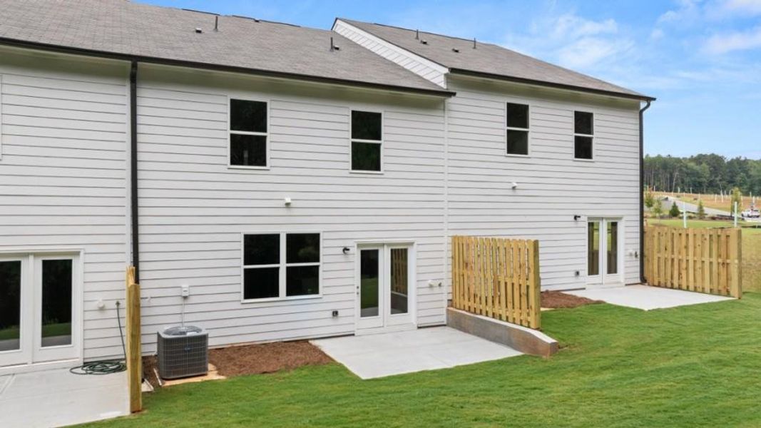 Exterior details and patio area of a home in Waypoint, Flowery Branch (Image 3).