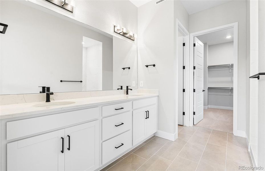 Furnished interior view inside a new home in Hilltop at Inspiration, Aurora (Image 21).