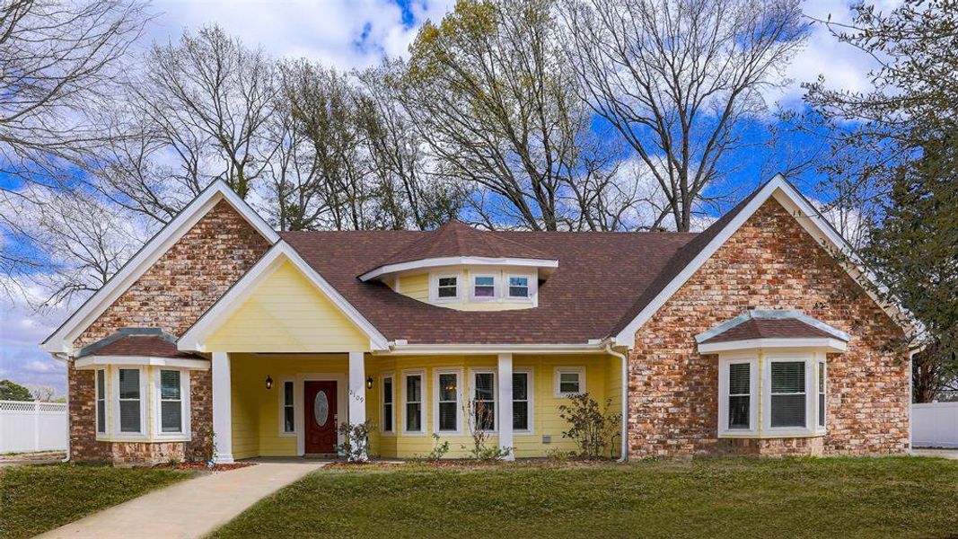 View of front of house featuring covered porch, stone siding, and roof with shingles View of front of house featuring covered porch, stone siding, and roof with shingles