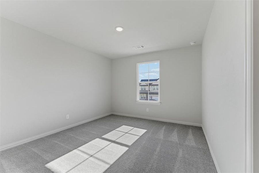 Spare room with light carpet