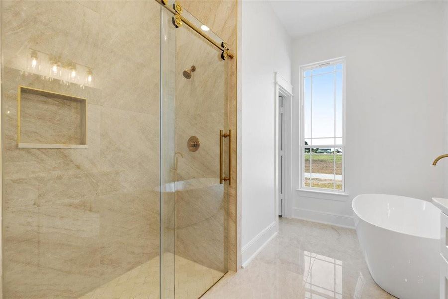 Walk-in shower featuring elegant tilework, glass enclosure, and contemporary finishes. Walk-in shower featuring elegant tilework, glass enclosure, and contemporary finishes.