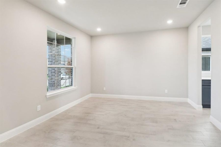 Spare room featuring light wood-type flooring