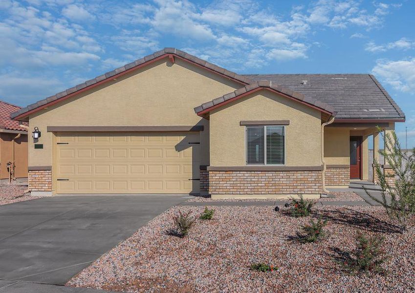 This home has a 2-car garage and gorgeous stone detailing.