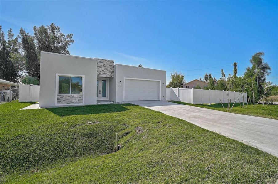 Exterior details and patio area of a home in , North Port (Image 24).