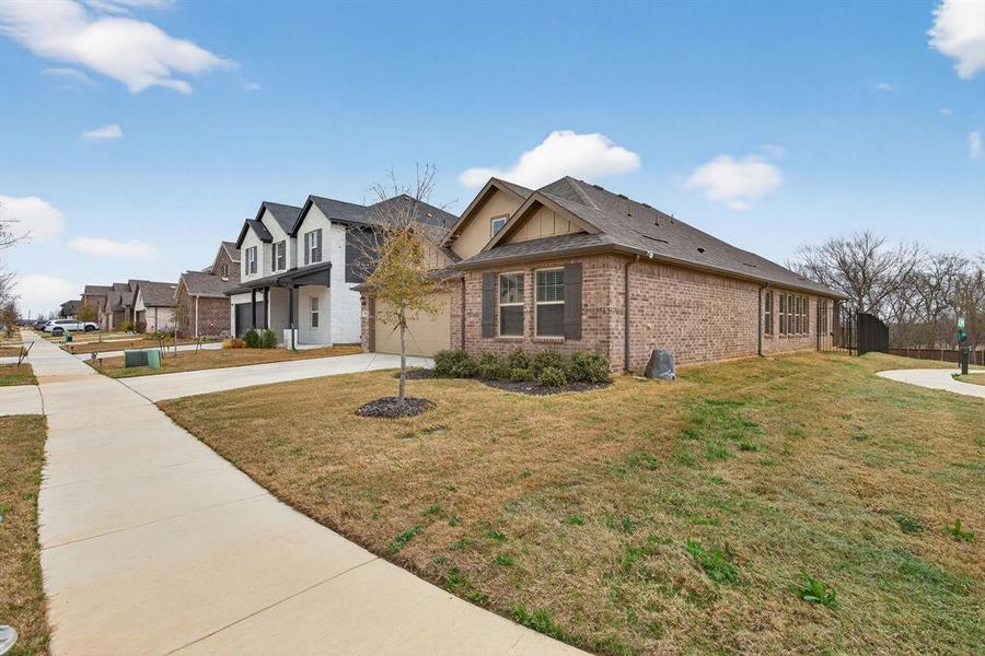 Front exterior of a new home in Sagebrook, Denton, TX, highlighting curb appeal (Image 21).
