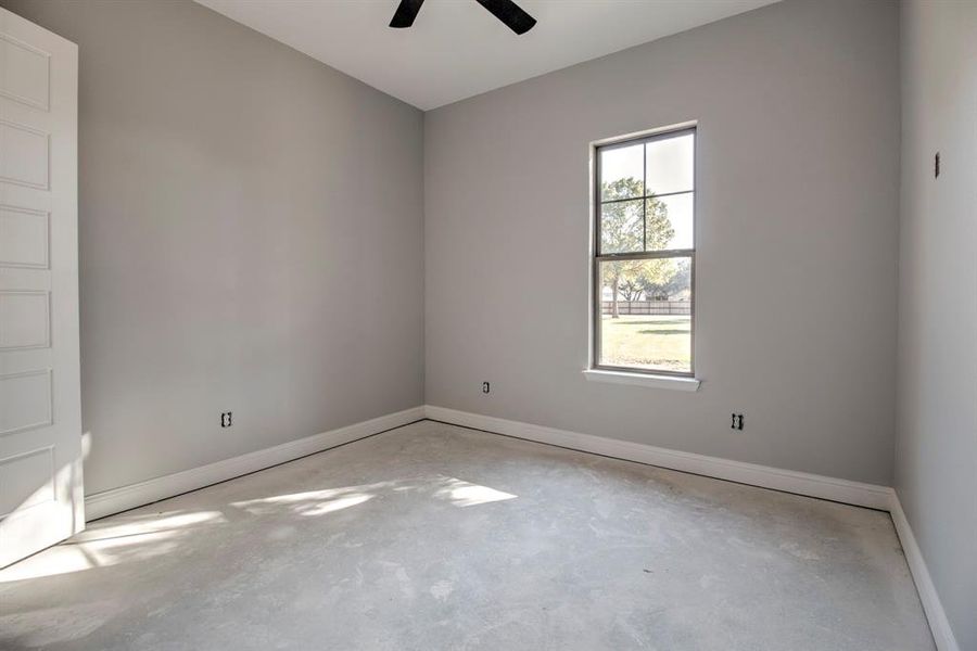 Unfurnished room featuring ceiling fan