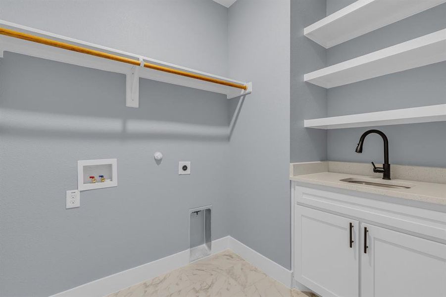 Laundry room with hookup for a washing machine, sink, light tile flooring, and hookup for an electric dryer