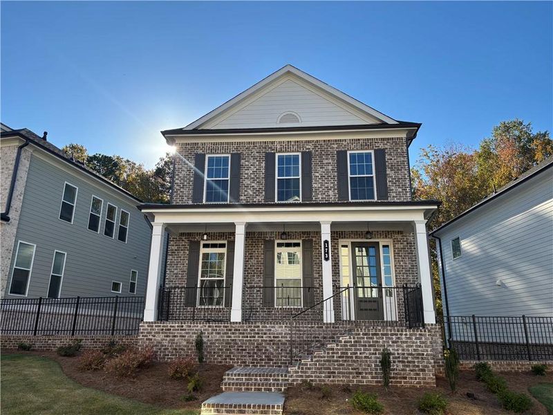 Exterior details and patio area of a home in Brackley Single Family, Cumming (Image 3).